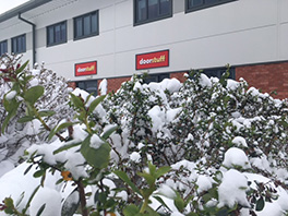 Snow on the tree branches outside the Doorstuff headquarters.